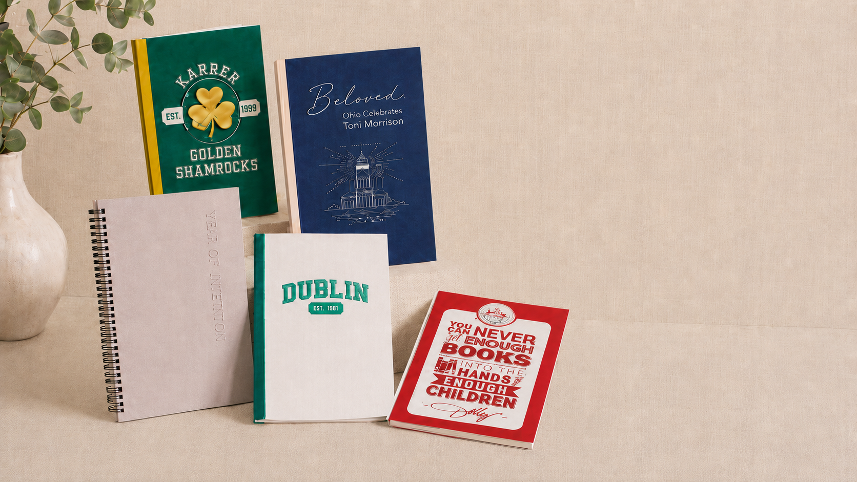 A collection of custom Ellie Frances Designs notebooks, including Karrer Golden Shamrocks, Ohio Celebrates Toni Morrison, Year of Intention, and Dublin covers